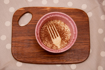 Tiramisu on the background of wooden board