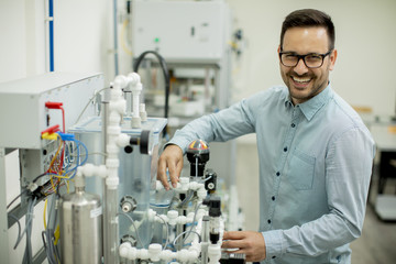 Young man in the electronic workshop