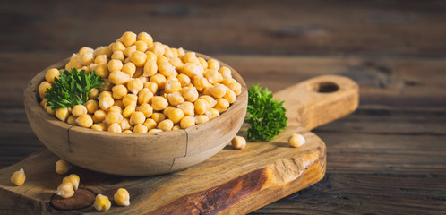 Fresh chickpeas in wooden bowl