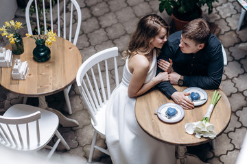 The romantic couple in love sitting in the restaurant