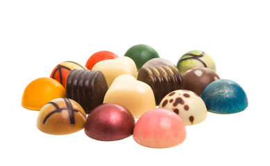 Obraz na płótnie Canvas chocolate candy in colored glaze isolated