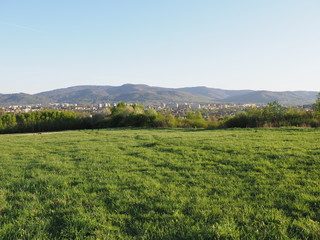 Awesome panorama of cityscape european Bielsko-Biala city and countryside landscape of grassy field at Beskids, POLAND