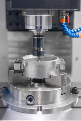 Fototapeta na wymiar High precision CNC machining center working, operator machining automotive sample part process