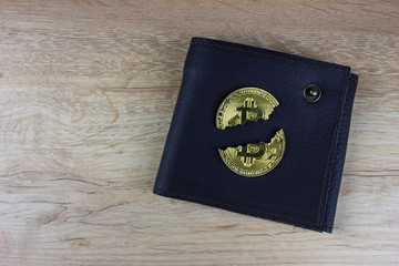 Broken bitcoin and wallet cryptocurrency falling. One USA dollar banknote.  Blockchain technology