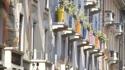 Coloured flower vases in a small town. This clip was shot with a Canon C300