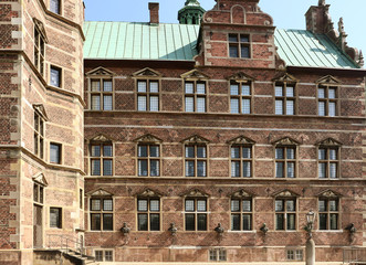 Fototapeta premium Copenhagen - the beautiful green bronze roofs and architecture of Rosenborg castle facade. The castle was built as country summerhouse in 1606 in Dutch Renaissance style.