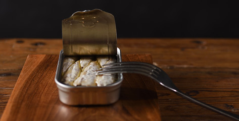 canned sardine on wooden table