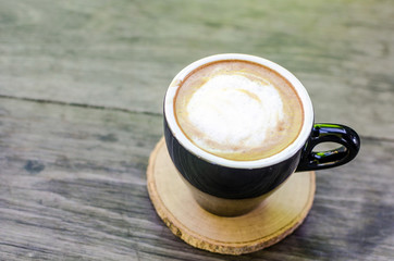 black coffee cup on wood, coffee time concept.