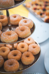 Close-up of sweet donuts on table, at wedding party