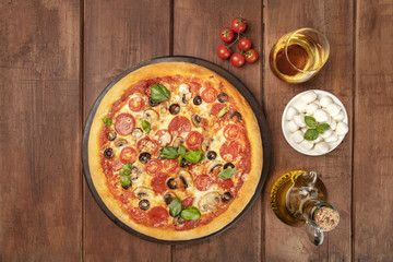 Pepperoni pizza with white wine, ingredients, and place for text