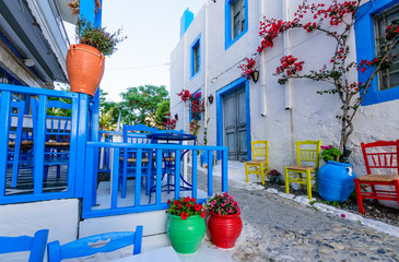 Beautiful street with flowers in the old town of Kos, Kos island, Dodecanese Islands, Greece - obrazy, fototapety, plakaty