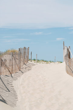 Entrance to a beach with wood fence