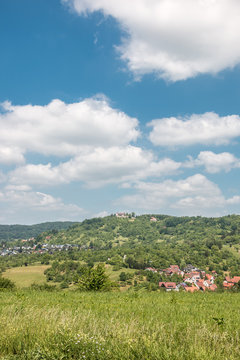 Little village in the middle of the german countryside with forests, fields and meadows