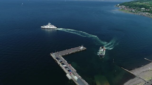 Aerial footage of ferries leaving and entering the harbour at Largs.