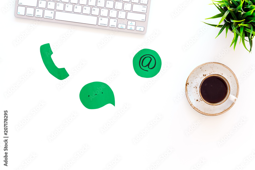 Aufkleber contact us concept. phone, message and email signs on office work desk with computer on white backgr