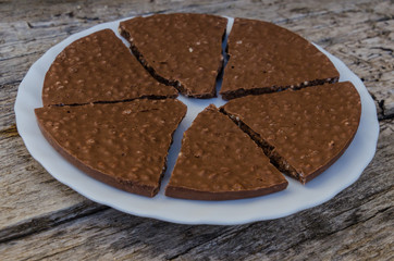 portions of crunchy chocolate and rice cake in a white plate