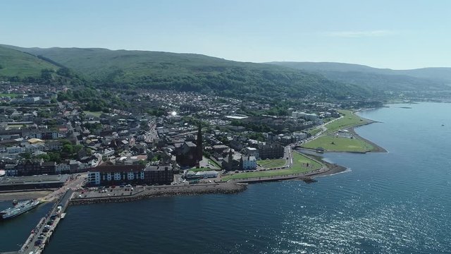 Aerial footage flying left at the town of Largs on the Firth of Clyde.