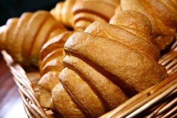 Croissants on a basket weave closeup of food