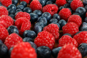 Closeup mix of raspberries and blueberries.