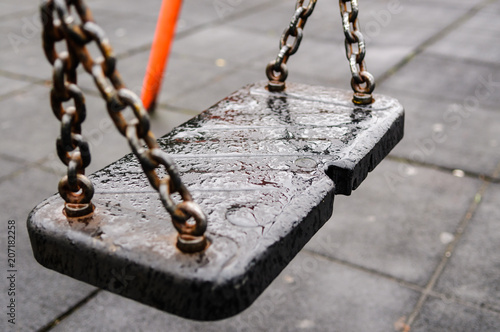 Empty Child S Play Park Swing In The Rain Stock Photo And