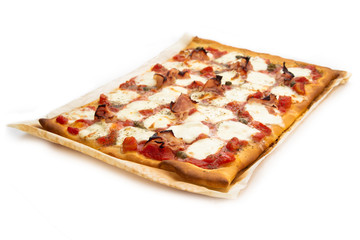 Homemade pizza with ham, mozzarella, tomato sauce, capers and oregano 