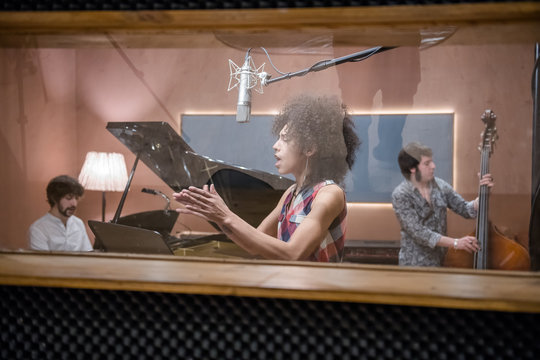 Woman singing and clapping hands