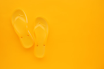 Top view of yellow flip flops pair