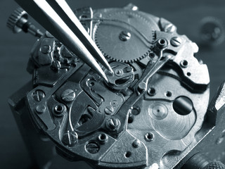 watchmaker repairing a vintage watch macro detail