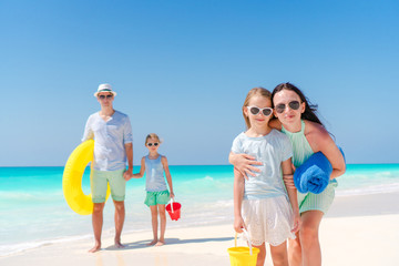 Family of four on a tropical beach