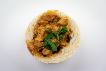 Chicken Bunny Chow with garnish