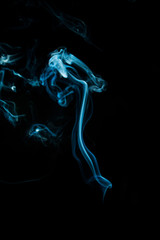 Abstract blue smoke isolated on black background