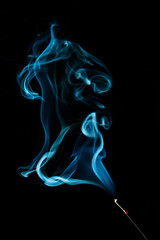 Abstract blue smoke isolated on black background