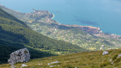 Italy, lake Garda. View from mountain Monte Baldo 1780 meters to Malcesine town.