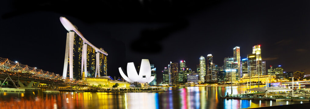 Landscape Of The Singapore Marina Bay Hotel, Bridge, Museum And Financial District At Night