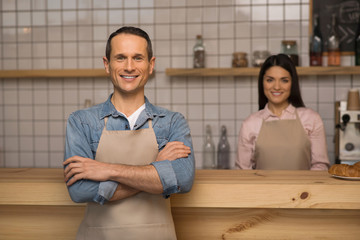 cafe owner with crossed arms