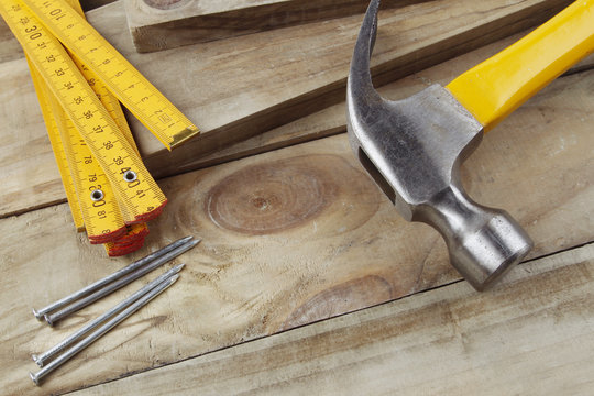 Hammer, nails and folding ruler