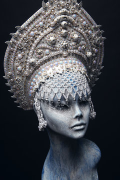 Head of mannequin in creative white metal kokoshnick with pearls