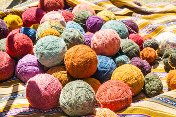 Colorful Balls of Yarn on a blanket