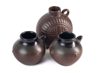 traditional Georgian ceramic utensils (chinchila) for wine on a white background
