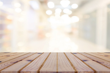 Perspective empty wooden table on top over blur background, can be used mock up for montage products display or design layout.