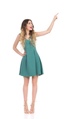 Elegant Woman In High Heels Is Standing, Touching Something And Laughing