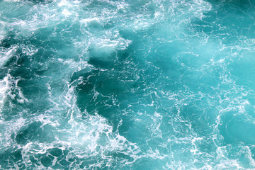 Fototapeta na wymiar Beautiful turquoise sea with sea foam. 