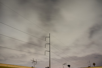 Urban Sky View with Power Lines and Tower