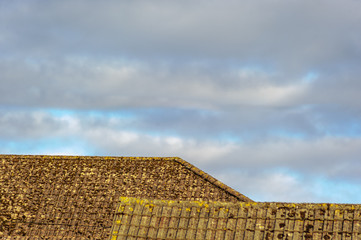 The roof of the building on a background of blue sky