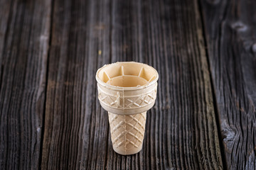 empty ice cream cone on wooden background