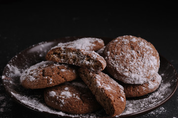 oatmeal cookies on a black table in castor sugar