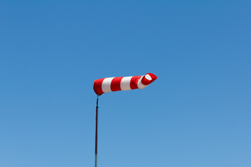 Windsock as a gauge for winds, wind vane on aerodrome airfield on an air show