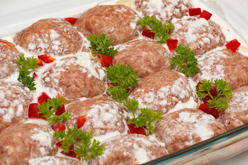 Meat minced red with aromatic seasonings on a white background.