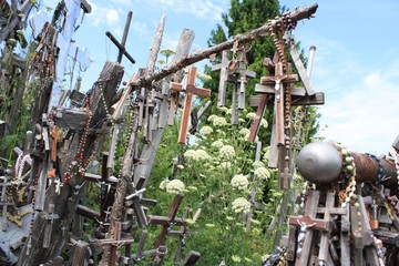 Crosses and flowers against blue sky