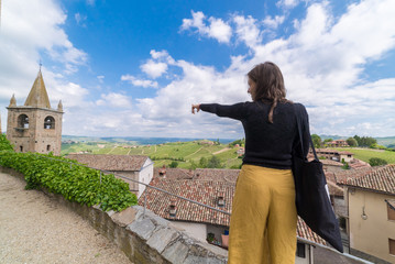 Fototapeta na wymiar Tourist in Serralunga d'Alba castle, medieval village in Piedmont, Langhe vineyards area, north Italy